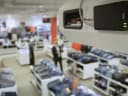 AXIS C8033 from AXIS COMMUNICATIONS - mounted on the wallof a clothing store