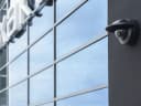 M3215-LVE mounted on building next to windows. from Axis Communications